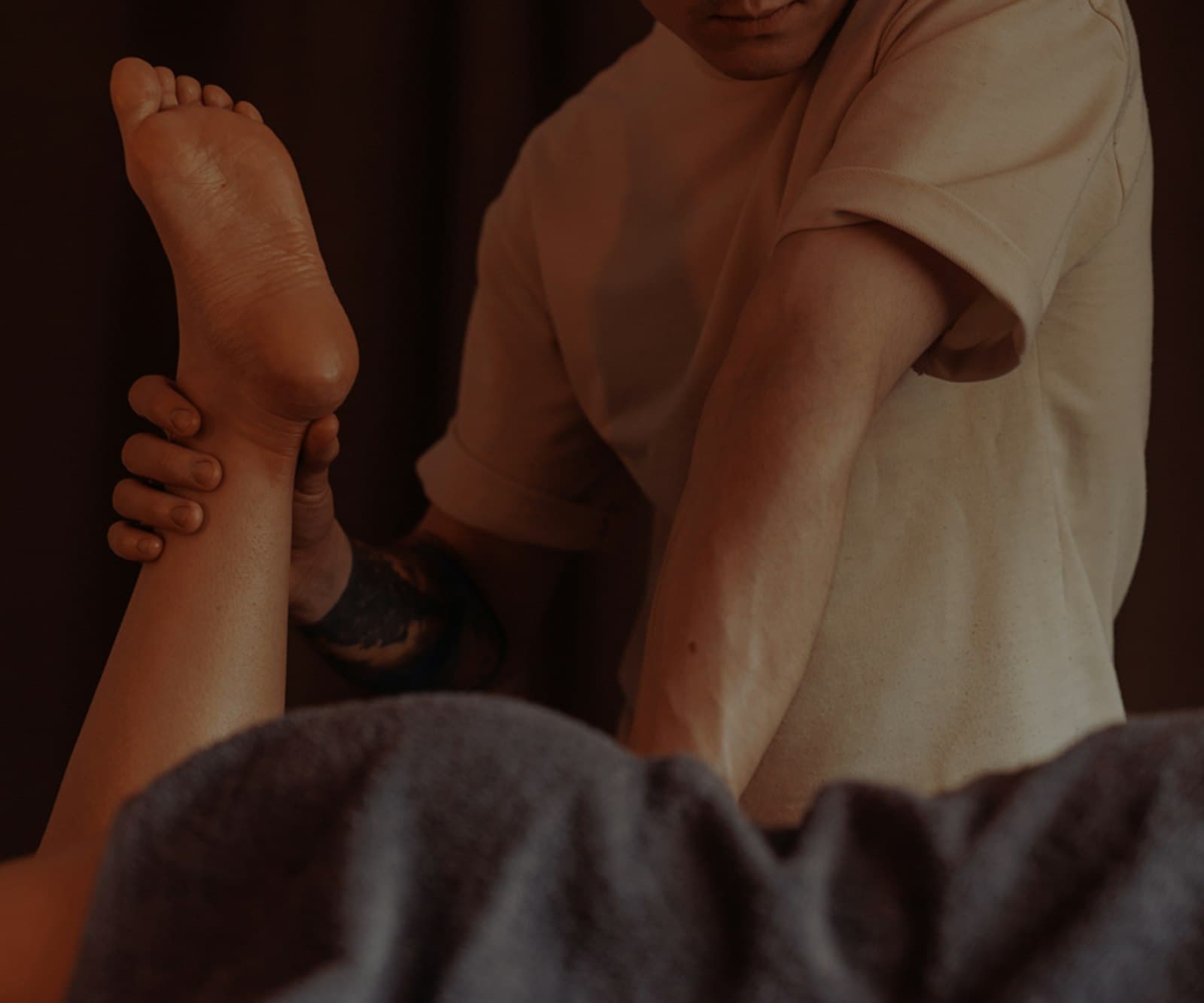 Firm massage pressure applied to a leg